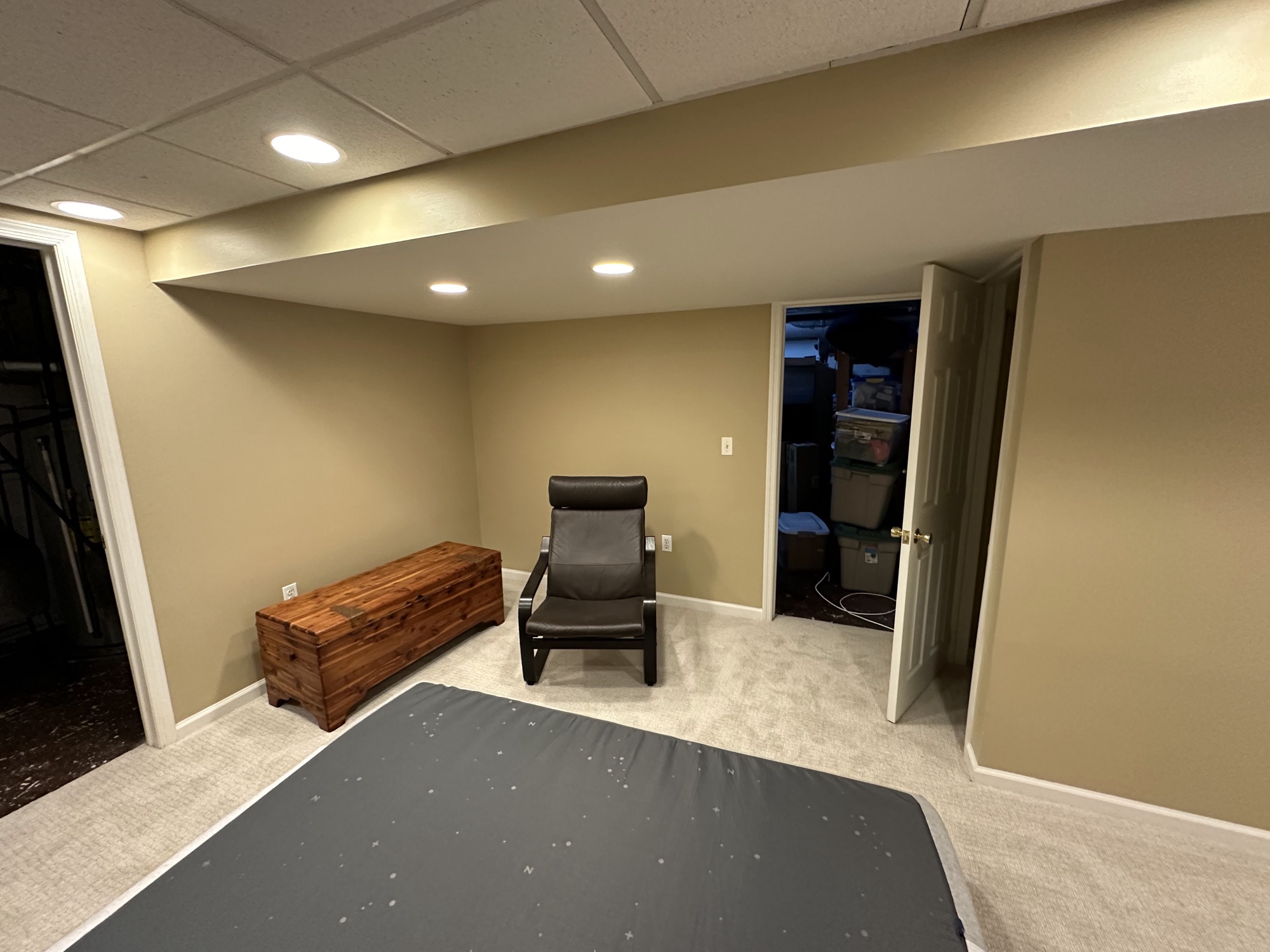 Finished basement room with tan walls by J&B Painting