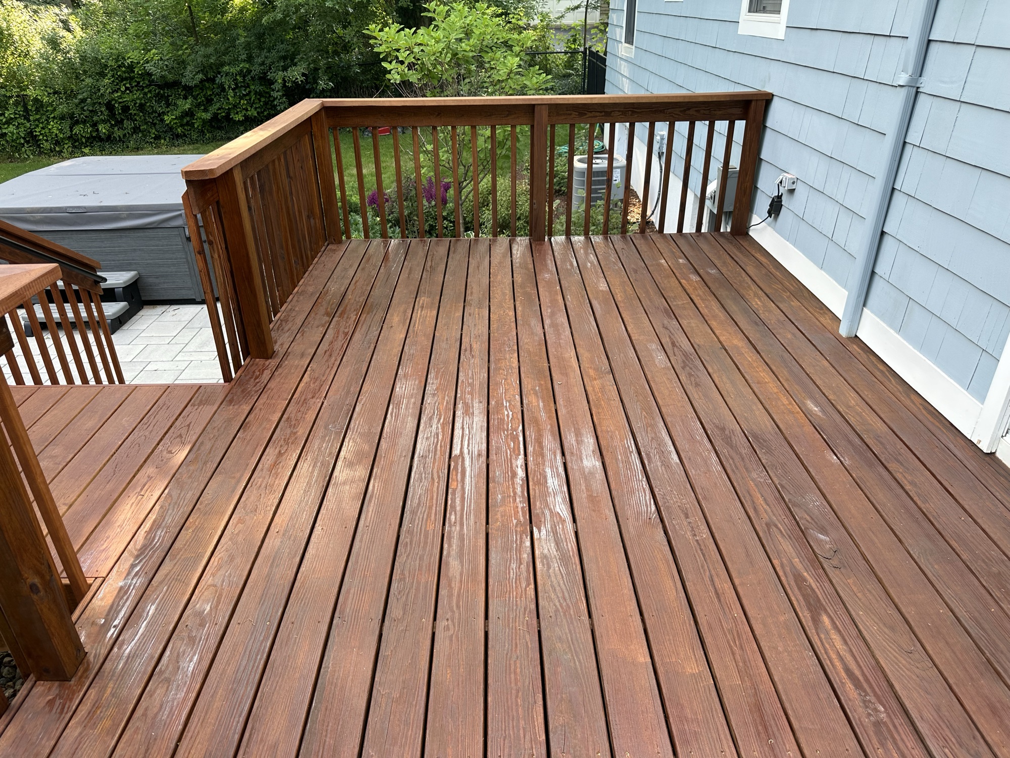 Top-down view of evenly stained deck surface by J&B Painting