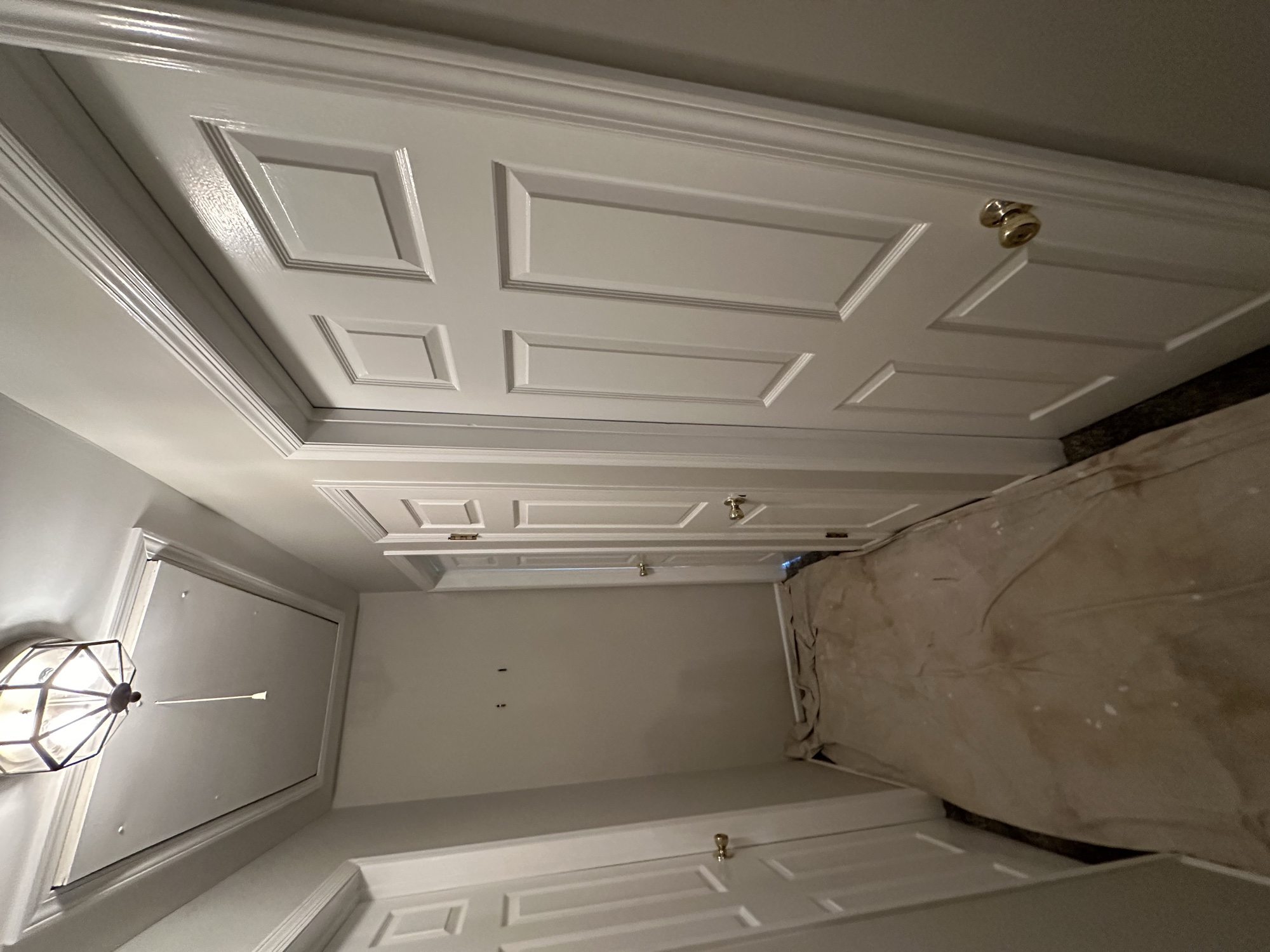 Elegant white paneled walls with decorative ceiling by J&B Painting