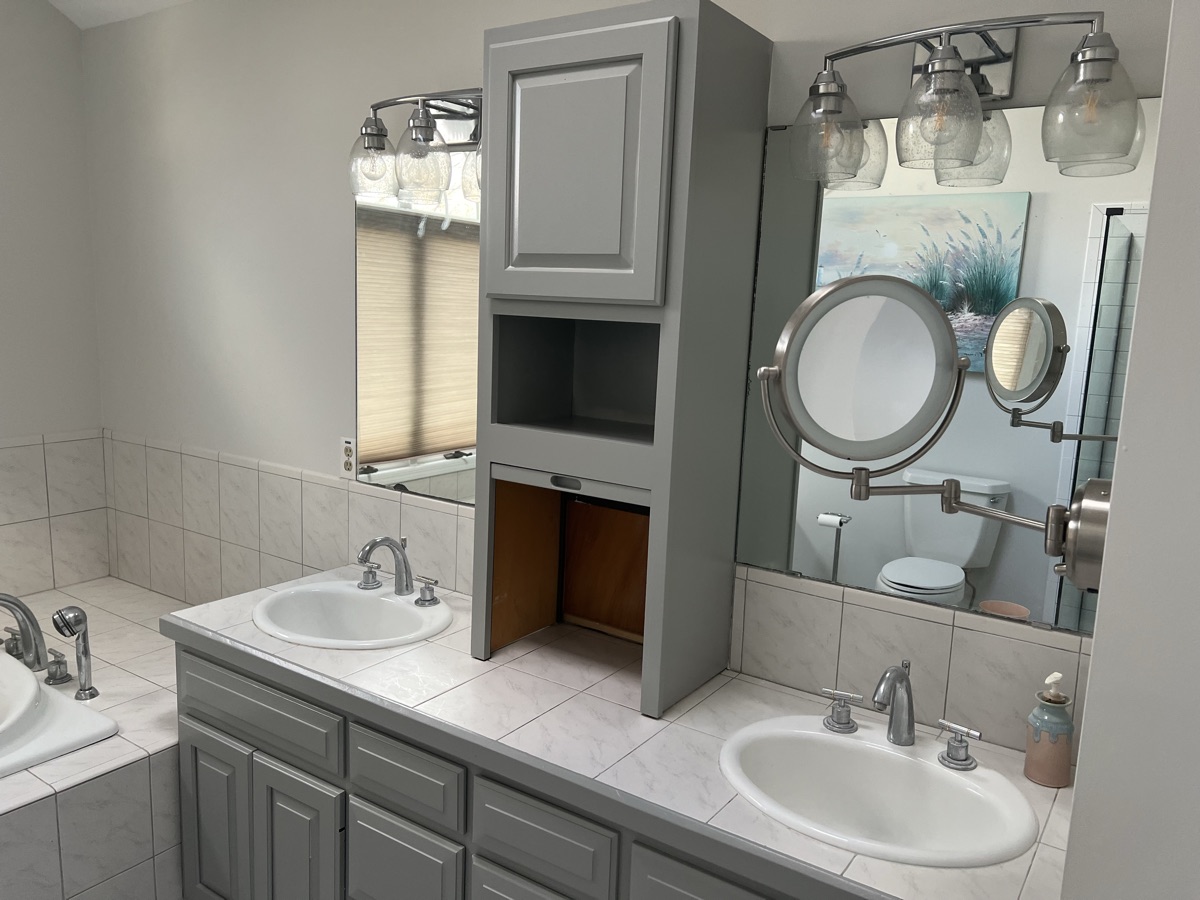 Painted gray vanity with storage tower close-up by J&B Painting