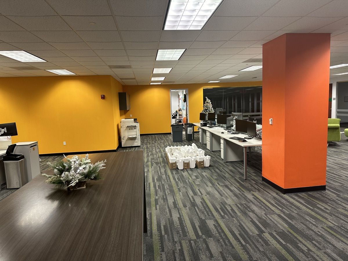Corporate office with yellow and orange accent features by J&B Painting