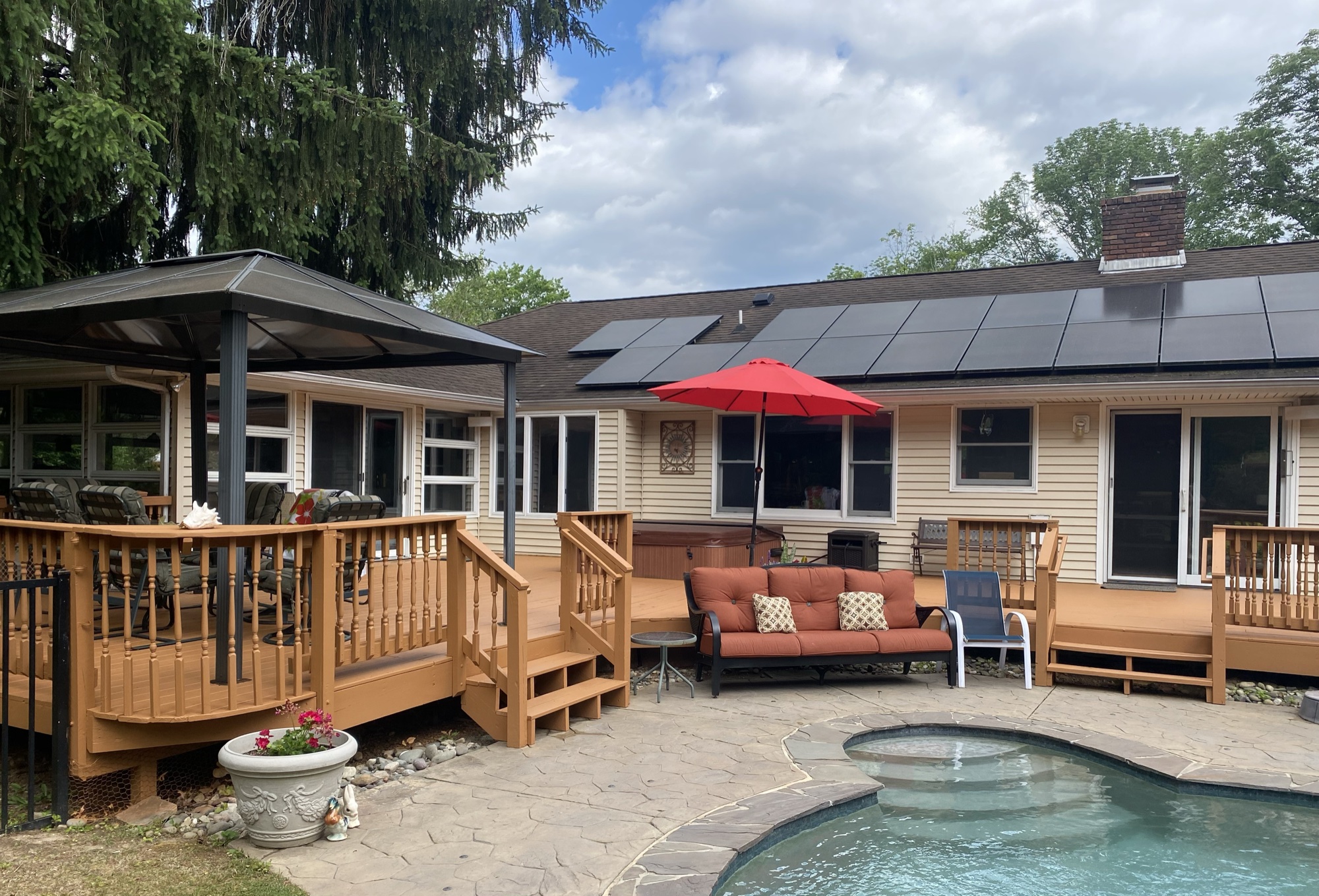 Pool house with professionally stained deck by J&B Painting