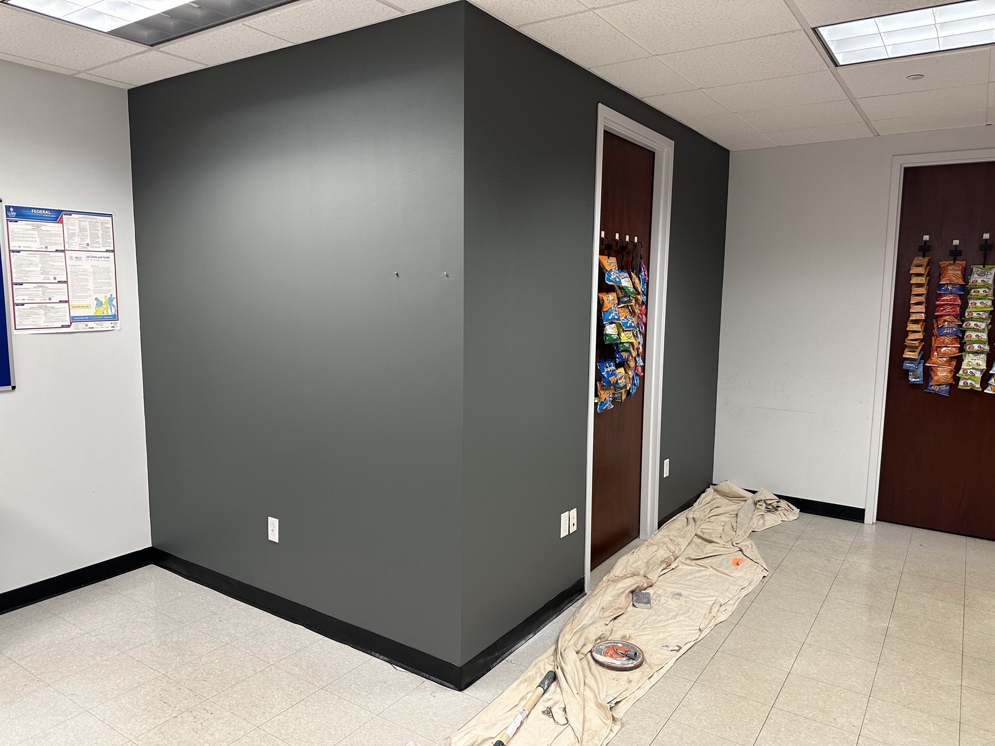 Commercial break room with dark accent wall by J&B Painting