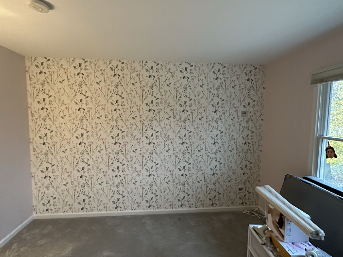 Botanical accent wall wallpaper installation
